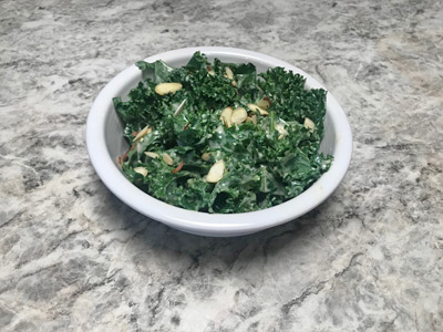 kale-salad-with-creamy-honey-dressing-and-chopped-almonds